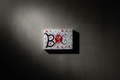 BLACK logo painting on studio wall